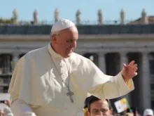 Pope Francis greets pilgrims gathered in St. Peter's Square during his Oct. 2, 2013 general audience. 