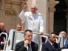 Pope Francis greets pilgrims in St. Peter's Square after Pentecost Sunday Mass on May 19, 2013. 