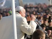 Pope Francis greets pilgrims in St. Peter's Square before the Wednesday general audience Dec. 11, 2013. 