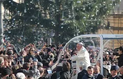 Pope Francis greets pilgrims in St. Peter's Square before the Wednesday general audience Dec. 11, 2013. ?w=200&h=150
