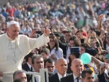 Pope Francis greets pilgrims in St. Peter's Square before the Wednesday general audience October 30, 2013. 