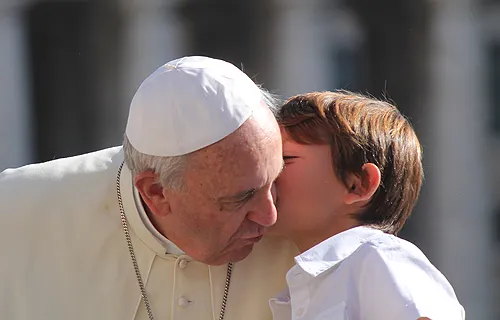Pope Francis greets a young pilgrim in St. Peter's Square before the Oct. 2, 2013 general audience. ?w=200&h=150