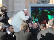 Pope Francis greets pilgrims in St. Peter's Square, Dec. 17, 2014. 