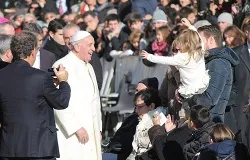 Pope Francis greets a family of pilgrims in St. Peter's Square, Dec. 4, 2013. ?w=200&h=150