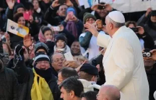 Pope Francis greets pilgrims in St. Peter's Square during the Wednesday General Audience on Dec. 4, 2013   Kyle Burkhart/CNA