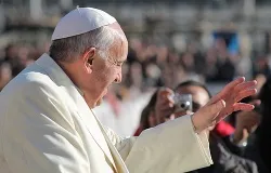 Pope Francis greets pilgrims in St. Peter's Square before the Wednesday general audience Dec. 4, 2013. ?w=200&h=150