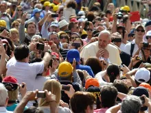 Pope Francis greets pilgrims in St. Peter's Square during the Wednesday general audience on May 28, 2014. 