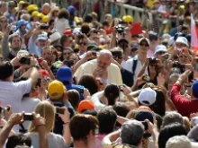 Pope Francis greets pilgrims in St. Peter's Square during the Wednesday general audience on May 28, 2014. 