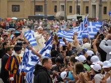 Pope Francis greets Greek pilgrims at a General Audience address in St. Peter's Square, June 25, 2014. 