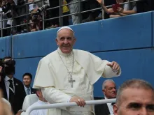 Pope Francis greets pilgrims in the World Cup Staduim of Daejeon during his Mass for the feast of the Assupmtion on Aug. 15, 2014. 