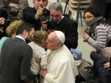 Pope Francis greets pilgrims present in the Vatican's Paul VI Hall for his Jan. 28, 2015 general audience. 