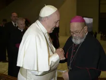 Pope Francis greets the then-Archbishop of Agana, Anthony Apuron, at the Vatican Feb. 7, 2018. 