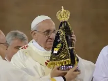 Pope Francis holds a statue of the Virgin Mary at the National Shrine of Our Lady of Aparecida July 24. 