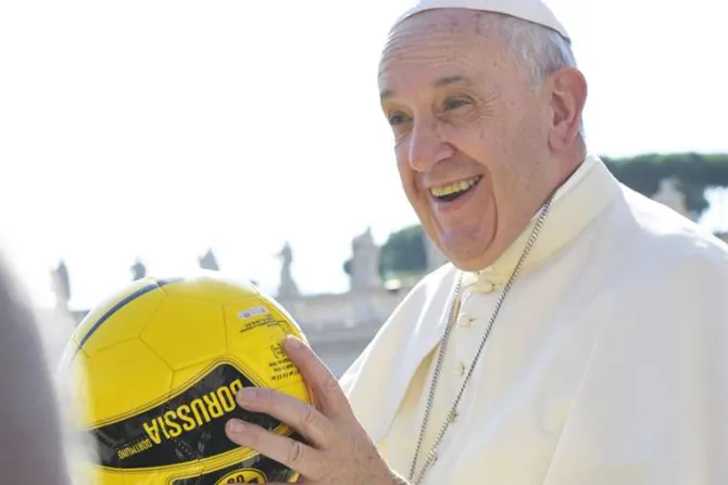 Pope Francis holds a soccer ball in St Peters Square during the Wednesday general audience on Aug 26 2015 Credit LOsservatore Romano CNA