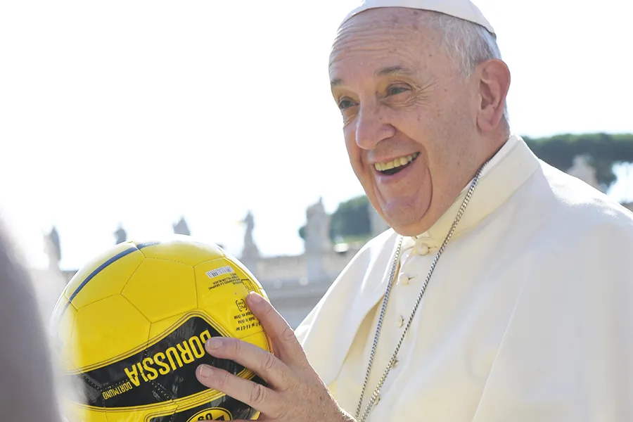 Pope Francis holds a soccer ball in St. Peter's Square during the Wednesday general audience on Aug. 26, 2015. L'Osservatore Romano.?w=200&h=150