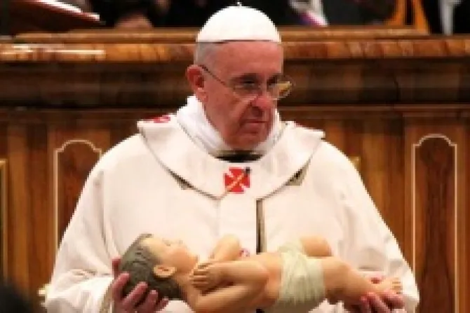 Pope Francis holds a statue of the Christ child for the nativity scene on December 24 2013 Credit Lauren Cater CNA CNA 12 24 13