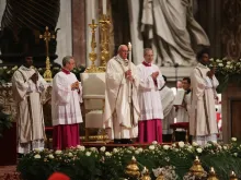 Pope Francis holds the Easter candle during the Easter Vigil April 4, 2015. 