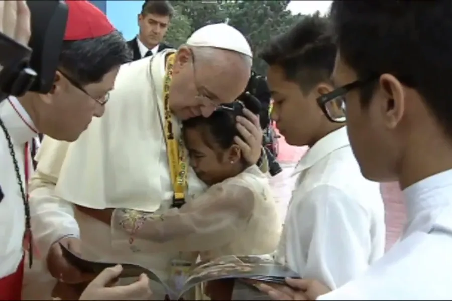 Pope Francis hugs a former homeless girl Glyzelle Palomar at a youth rally in Manila Jan. 18?w=200&h=150