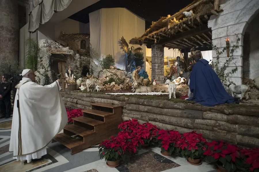Pope Francis incenses the nativity scene in St. Peter's Basilica Dec. 24, 2017. Vatican Media.