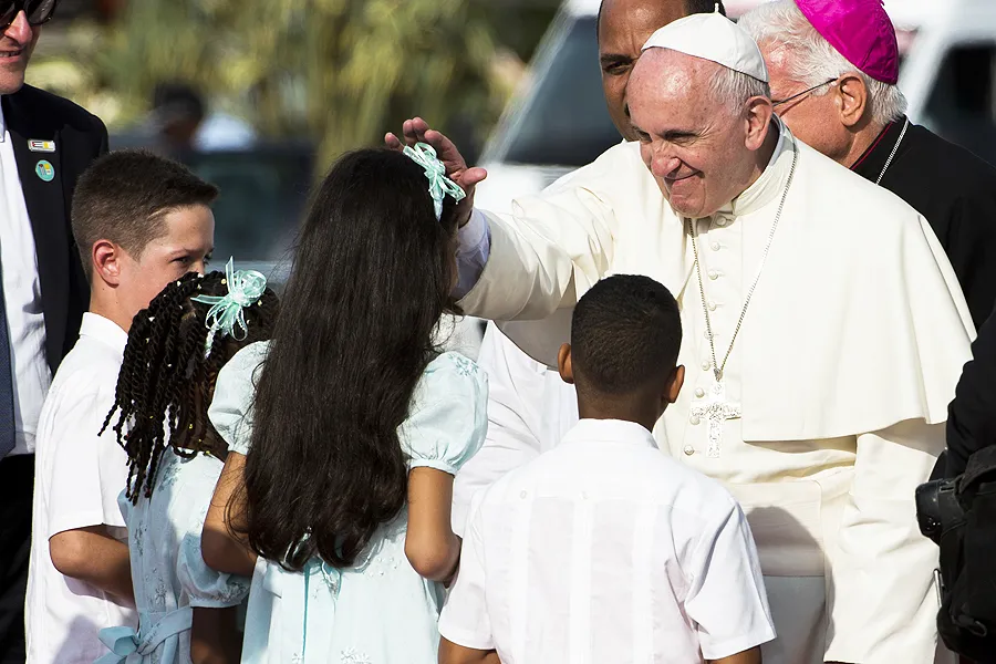 Pope Francis is greeted by children in Santiago de Cuba, Sept. 22, 2015. ?w=200&h=150