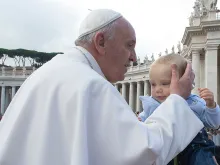 Pope Francis kisses a baby at the general audience in St. Peter's Square on Oct. 7, 2015. 