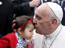 Pope Francis kisses a baby girl during his trip to Fatima May 12-13, 2017. 