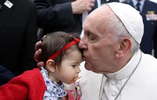 Pope Francis kisses a baby girl during his trip to Fatima May 12-13, 2017.   LUSA Press Agency.