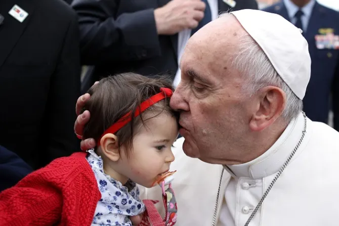 Pope Francis kisses a baby girl during his trip to Fatima May 12 13 2017 Credit LUSA Press Agency CNA