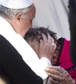 Pope Francis kisses a man suffering from boils in Saint Peter's Square at the end of his Wednesday general audience, Nov. 6 2013.?w=200&h=150