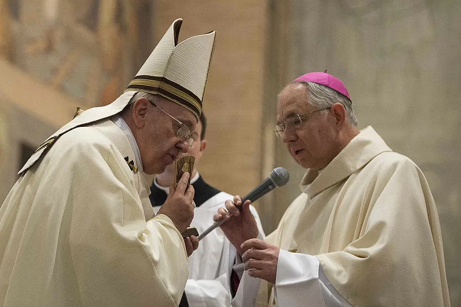 Pope Francis kisses a relic of St. Junipero Serra presented by Archbishop Jose Gomez of Los Angeles at the Ponticial North American College in Rome, May 2, 2015. ?w=200&h=150