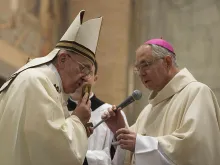 Pope Francis kisses a relic of St. Junipero Serra presented by Archbishop Jose Gomez of Los Angeles at the Ponticial North American College in Rome, May 2, 2015. 