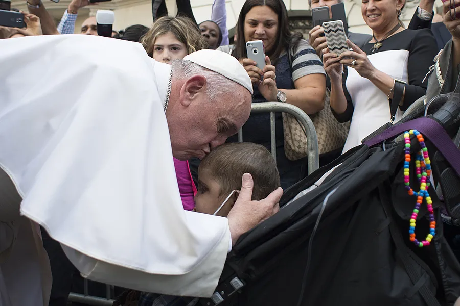 Pope Francis kisses a young child during a special meeting with sick children in New York City, Sept. 25, 2015. ?w=200&h=150
