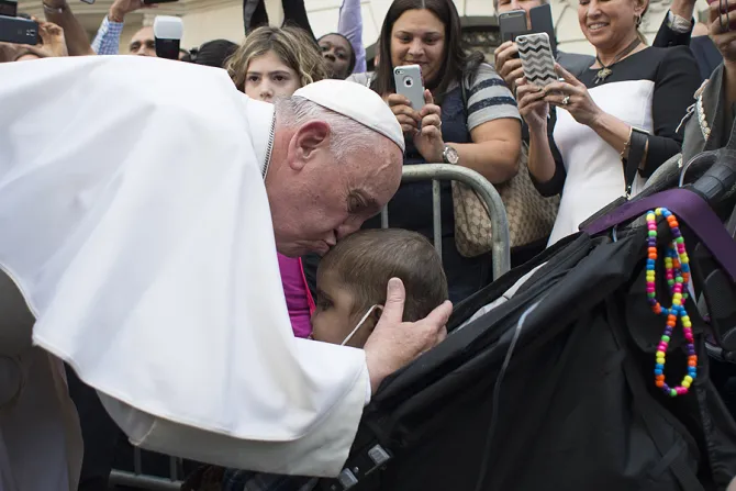 Pope Francis kisses a young child during a special meeting with sick children in New York City Sept 25 2015 Credit LOsservatore Romano CNA 9 26 15