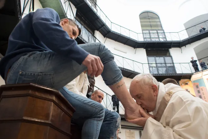 Pope Francis kisses prisoners feet at Rome Regina Coeli Prison March 29 2018 Credit Vatican Media CNA