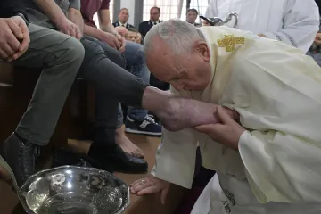 Pope Francis kisses the foot of a prisoner during Holy Thursday Mass April 18 2019 Credit Vatican Media