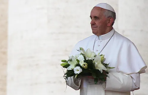 Pope Francis lays flowers at the foot of the statue of Our Lady of Lujan on May 8, 2013. ?w=200&h=150