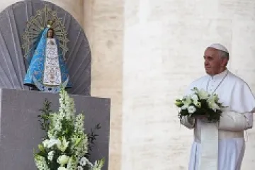 Pope Francis lays flowers at the foot of the statue of Our Lady of Lujan on May 8 2013 Credit Stephen Driscoll CNA CNA 5 8 13