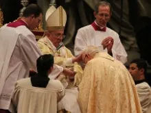 Pope Francis lays his hands on Bishop Fernando Vergez during his episcopal ordination in St. Peter's Basilica on Nov. 15, 2013 