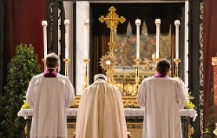 Pope Francis, together with his masters of ceremonies, reverences the Eucharist at St. Mary Major's in Rome following the Corpus Christi procession, June 19, 2014.   Daniel Ibanez/CNA.