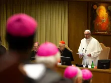 Pope Francis speaks to bishops inside the Synod Hall. 
