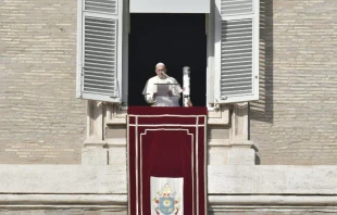 Pope Francis lights a candle for Syria during the Angelus Dec. 2, 2018.   Vatican Media.
