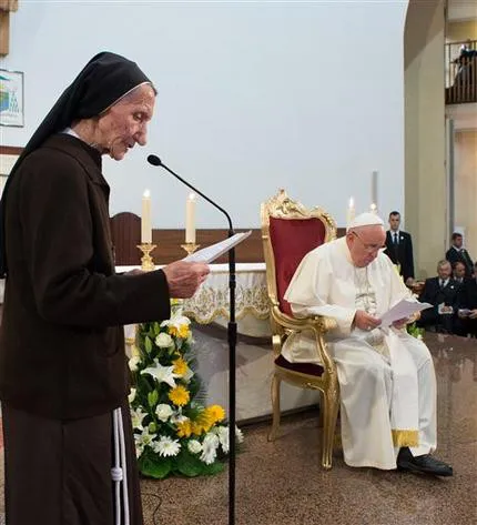Pope Francis listens as 85-year-old Sister Maria Kaleta speaks in Tirana's St. Paul Cathedral, Albania, Sunday, Sept. 21, 2014. ?w=200&h=150