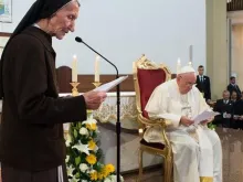 Pope Francis listens as 85-year-old Sister Maria Kaleta speaks in Tirana's St. Paul Cathedral, Albania, Sunday, Sept. 21, 2014. 