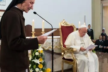 Pope Francis listens as 85 year old Sister Maria Kaleta speaks in Tiranas St Paul Cathedral Albania Sunday Sept 21 2014 Credit  LOsservatore Romano 92514 CNA