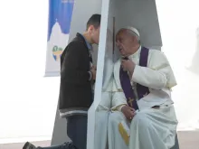 Pope Francis listens to confessions on July 26, 2013 during World Youth Day in Rio de Janeiro, Brazil. 