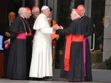Pope Francis greets an Italian cardinal outside the Vatican's Synod Hall at the beginning of the general assembly of the Italian bishops' conference, May 19, 2014. 