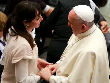 Pope Francis meets with a woman at the general audience in Paul VI Hall on Jan. 13, 2016. 