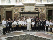 Pope Francis meets with members of the Vatican's annual charity concert in Vatican City on Dec. 15, 2017. 