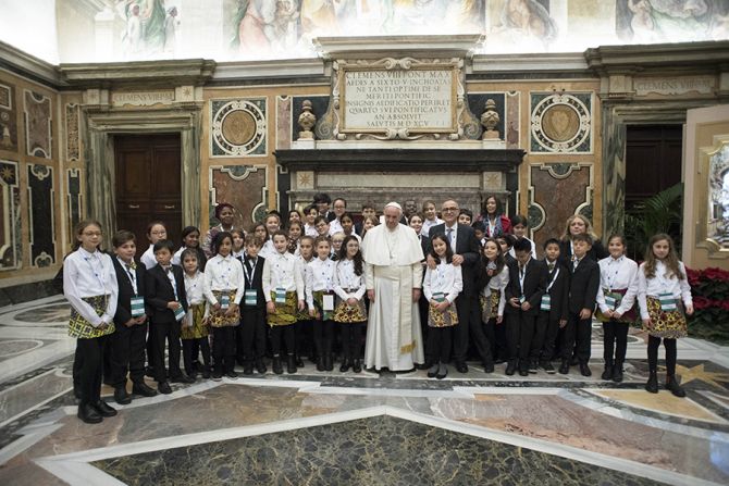 Pope Francis meets with members of the Vaticans annual charity concert in Vatican City on Dec 15 2017 Credit LOsservatore Romano CNA
