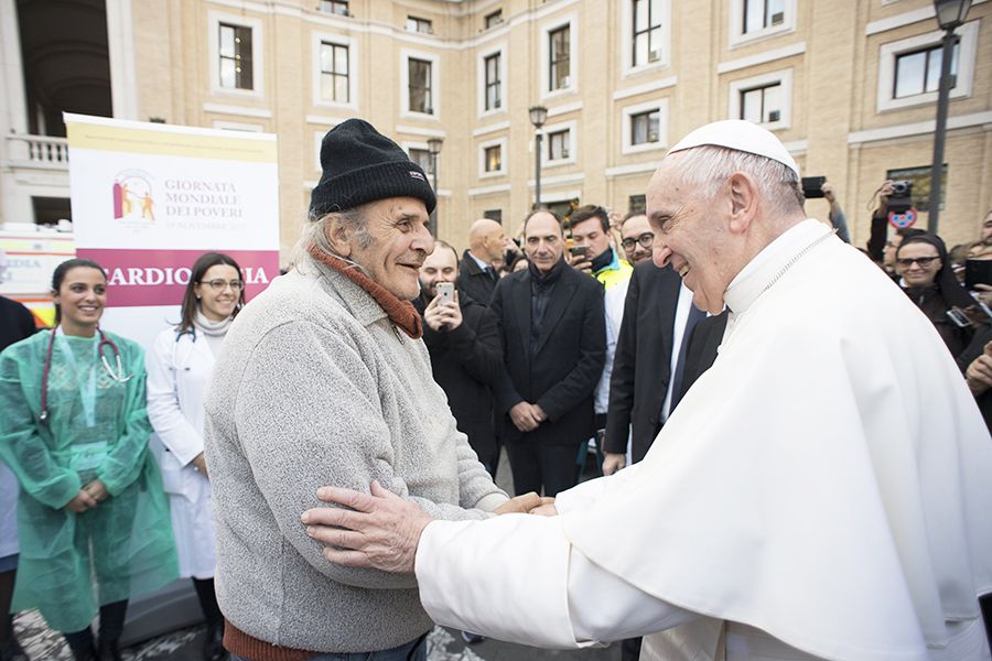 Pope Francis greets a participant in the World Day of the Poor in Rome, Nov. 16, 2017.?w=200&h=150